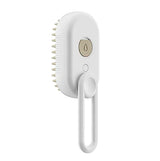 White pet grooming brush with silicone bristles and ergonomic handle for gentle care